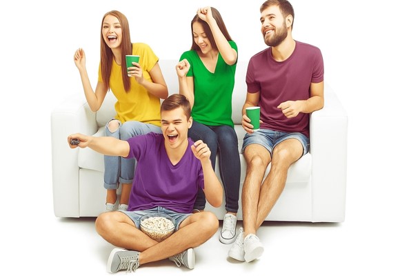 A Canadian family cheering while watching live sport on TeleNorth IPTV